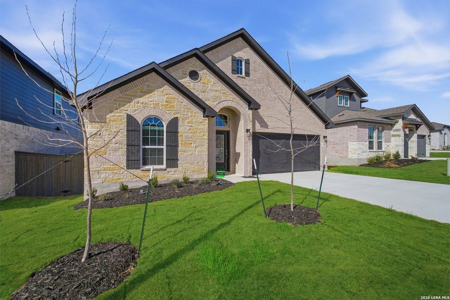 Front exterior of a new home in The Woodlands at Medina Hills, Mico, TX, highlighting curb appeal (Image 2).