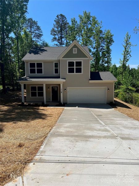 Front exterior of a new home in , Statesville, NC, highlighting curb appeal (Image 2). Front exterior of a new home in , Statesville, NC, highlighting curb appeal (Image 2).