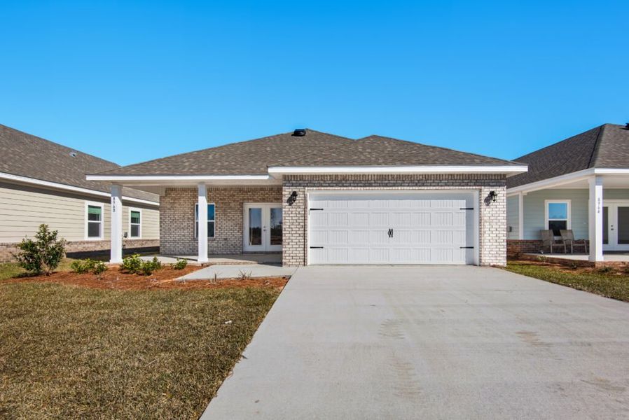 Front exterior of a new home in Yellow River Ranch, Milton, FL, highlighting curb appeal (Image 10).