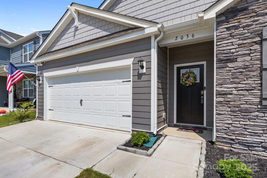 Front exterior of a new home in Secrest Commons, Monroe, NC, highlighting curb appeal (Image 1).