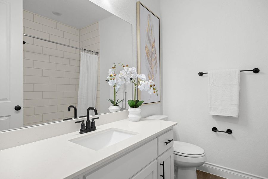 Full bathroom featuring vanity and a tile shower