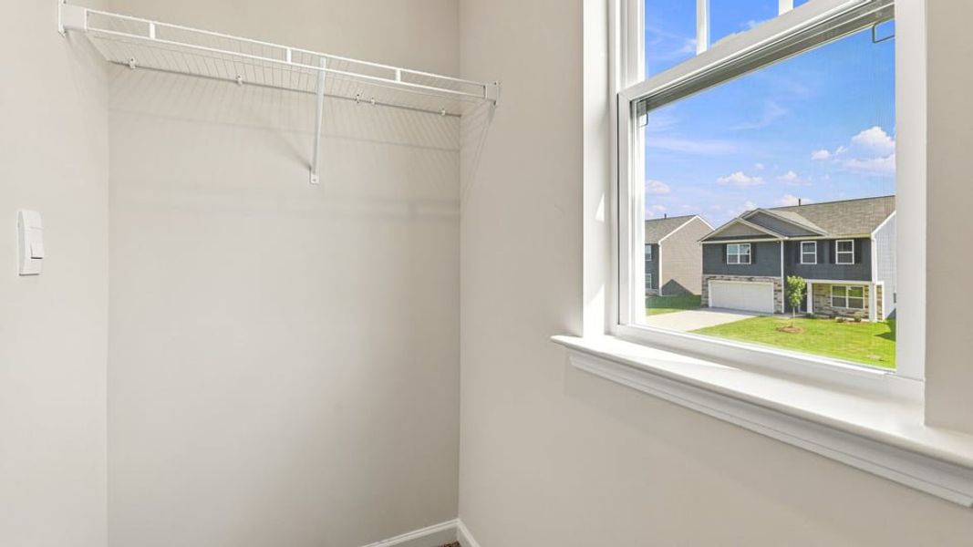 Spacious, unfurnished interior of a new home in Bentley Park, Greenwood (Image 34).