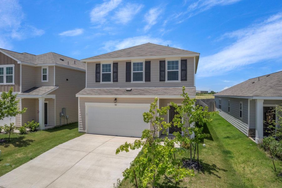 Front exterior of a new home in Cottonwood Farms, Hutto, TX, highlighting curb appeal (Image 19). Front exterior of a new home in Cottonwood Farms, Hutto, TX, highlighting curb appeal (Image 19).