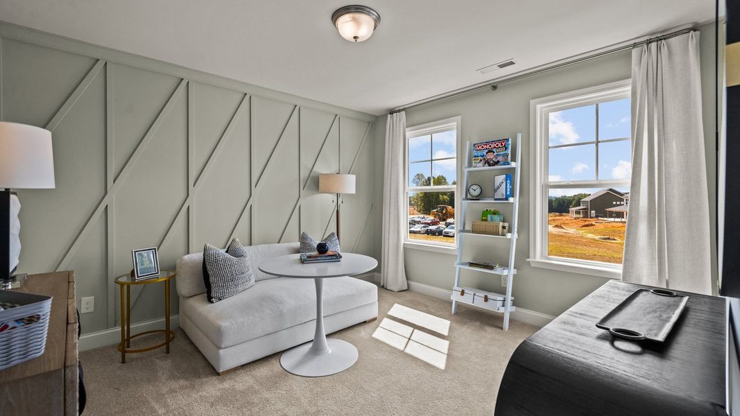 Flexible bedroom with elevated ceiling, large windows, and premium finishes, in the Townsend Design by DRB Homes in York, SC