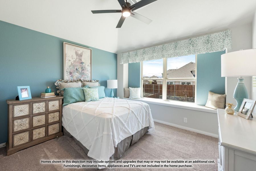 Bedroom with teal walls, vaulted ceiling, ceiling fan, window seat, and carpeted floors Bedroom with teal walls, vaulted ceiling, ceiling fan, window seat, and carpeted floors
