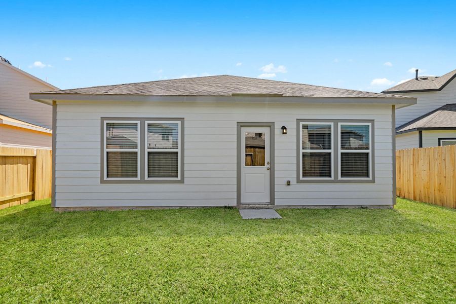 Exterior details and patio area of a home in Granger Pines, Conroe (Image 19).