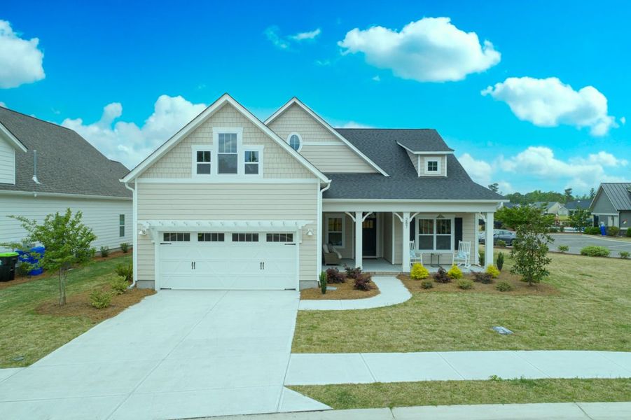 Representative exterior photo of a completed home built from the Ashton by Bill Clark Homes in Osprey Landing, Southport, NC (Image 30). Representative exterior photo of a completed home built from the Ashton by Bill Clark Homes in Osprey Landing, Southport, NC (Image 30).