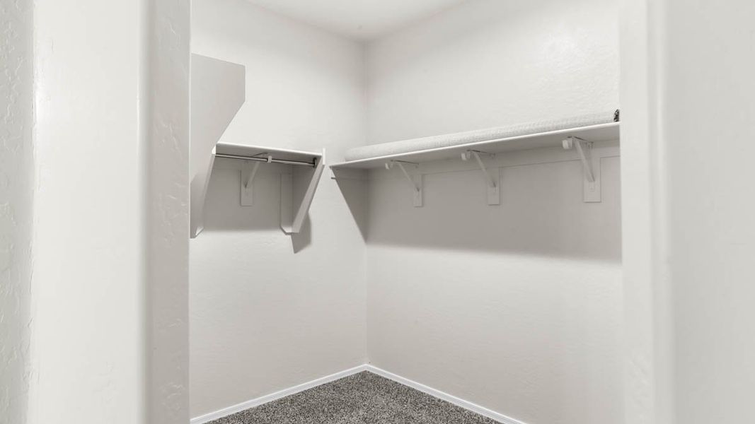 Representative unfurnished interior of a home built from the McCormick by D.R. Horton in Rio Rancho Estates, Surprise (Image 24).