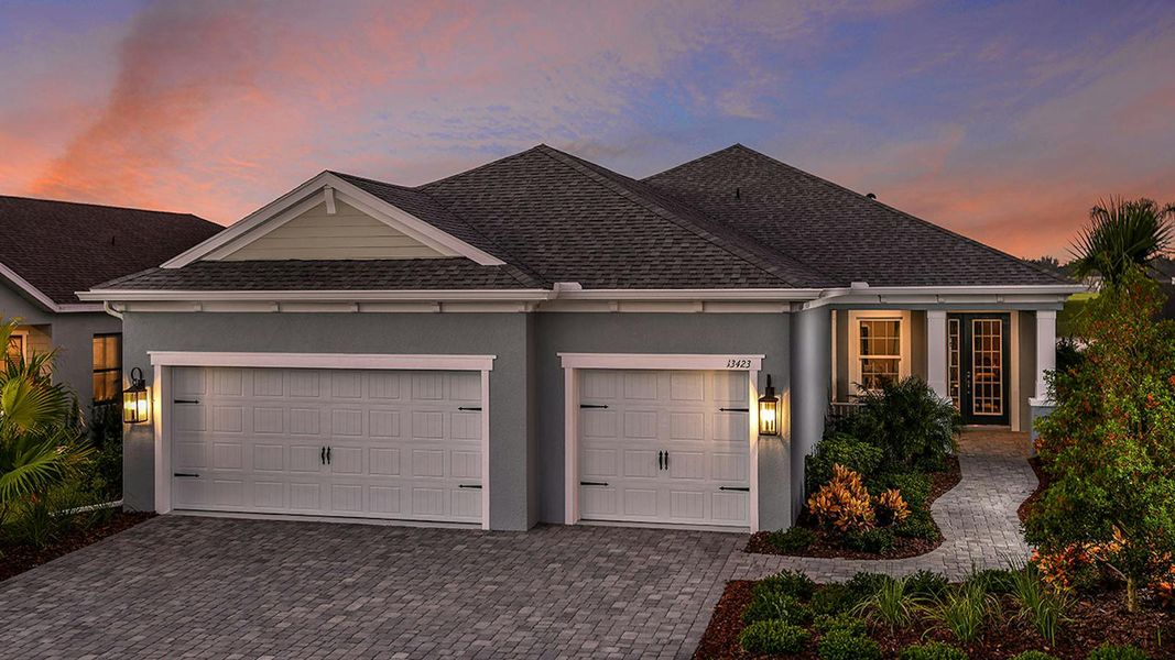 Front exterior of a new home in Canoe Creek Real Estate and Homes for Sale in Parrish, FL - Neal Communities, Parrish, FL, highlighting curb appeal (Image 22).
