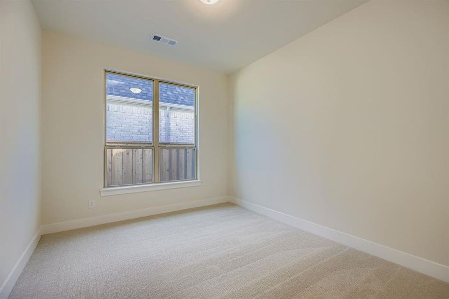 Unfurnished room featuring light colored carpet and baseboards Unfurnished room featuring light colored carpet and baseboards