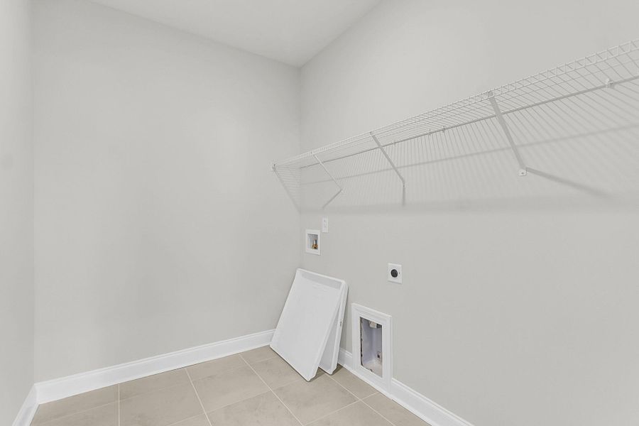 Spacious, unfurnished interior of a new home in Tidewater at Lakes of Cane Bay, Summerville (Image 53).