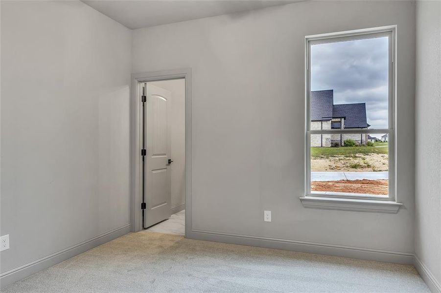 Spare room with light colored carpet