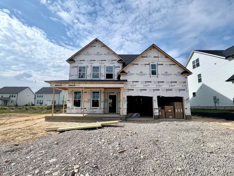 Front exterior of a new home in Glenmere, Knightdale, NC, highlighting curb appeal (Image 7). Front exterior of a new home in Glenmere, Knightdale, NC, highlighting curb appeal (Image 7).