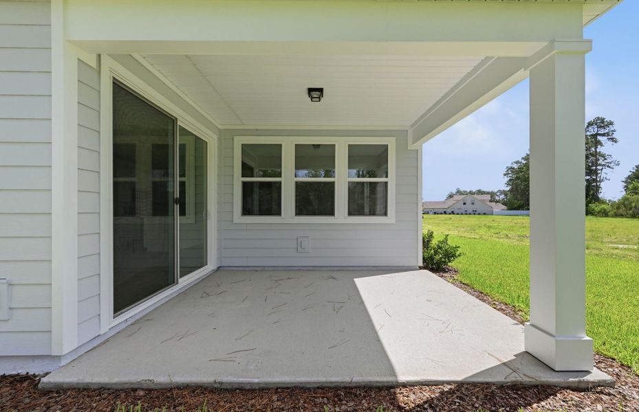 Exterior details and patio area of a home in Fiddler's Cove, Kingsland (Image 3).