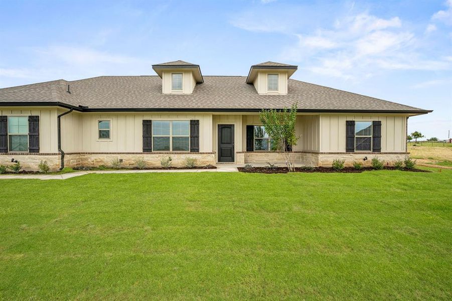 View of front of house with a front lawn