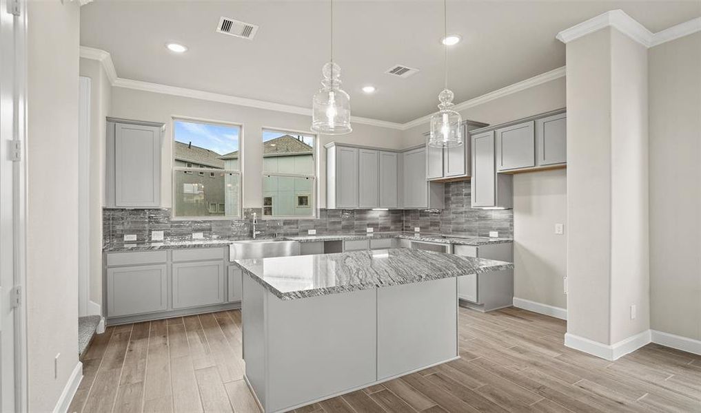 Elegant lighting in kitchen (*Photo not of actual home and used for illustration purposes only.)