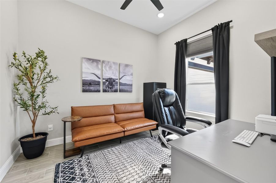 Private home office with large window and flexible workspace. Private home office with large window and flexible workspace.