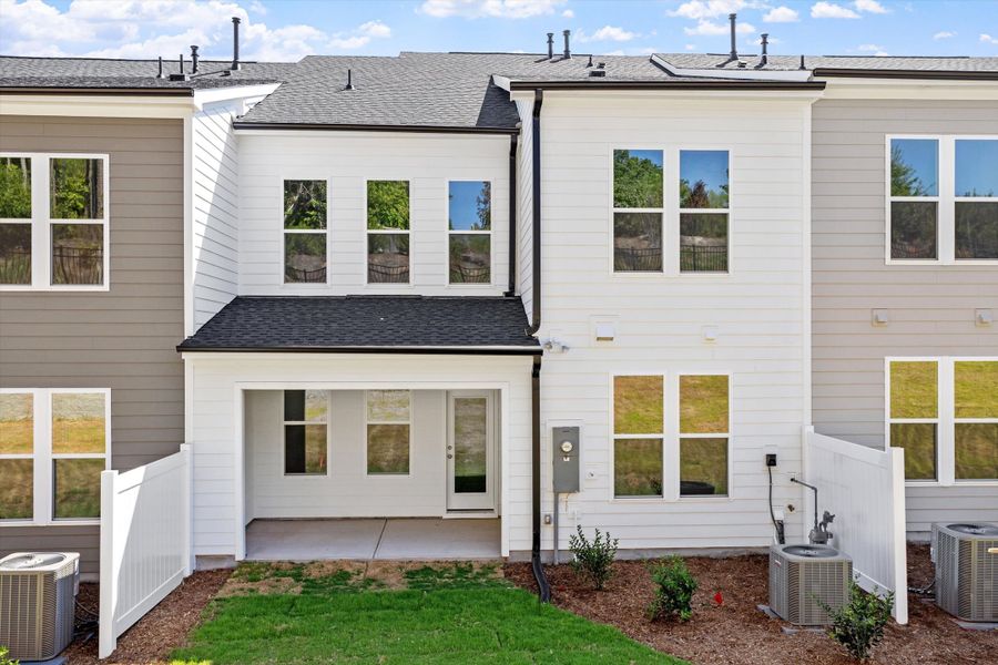 Exterior details and patio area of a home in Ovation at Sweetbrier, Durham (Image 4).