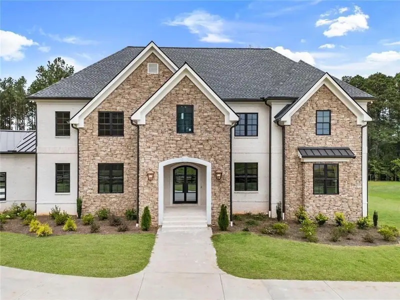 Front exterior of a new home in , Milton, GA, highlighting curb appeal (Image 2). Front exterior of a new home in , Milton, GA, highlighting curb appeal (Image 2).