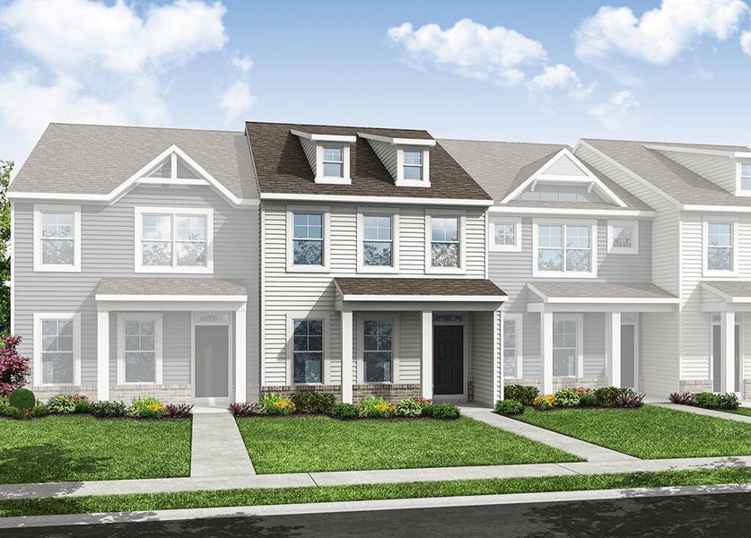 Front exterior of a new home in Enclave at Traditions Townhomes, Wake Forest, NC, highlighting curb appeal (Image 1). Front exterior of a new home in Enclave at Traditions Townhomes, Wake Forest, NC, highlighting curb appeal (Image 1).