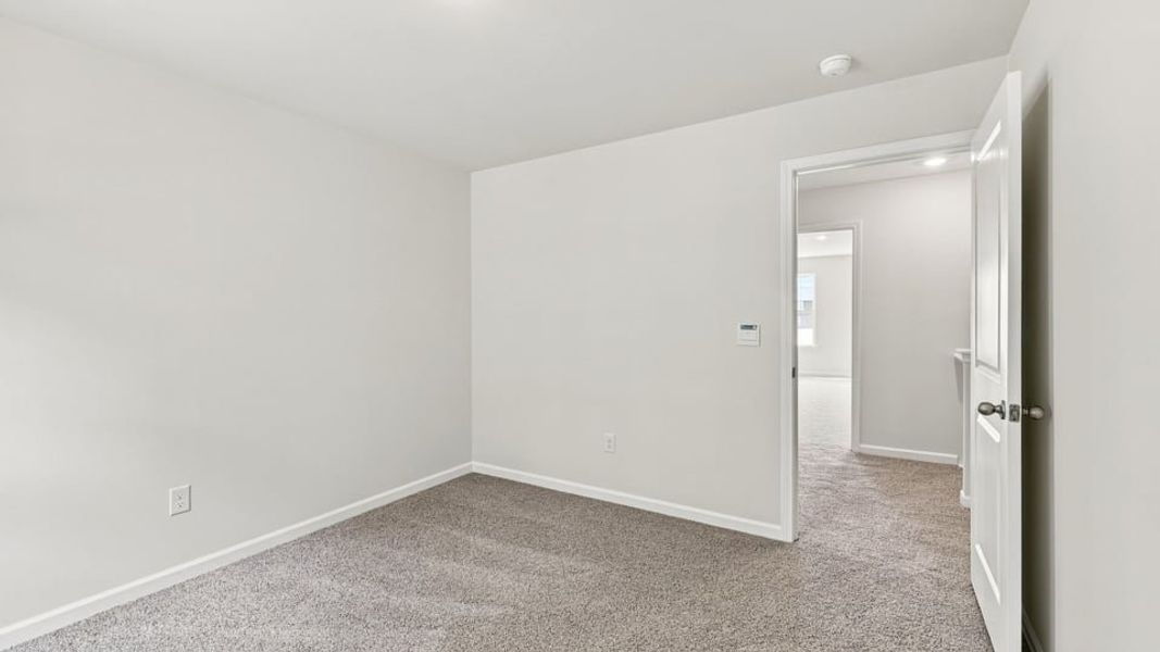 Spacious, unfurnished interior of a new home in Bentley Park, Greenwood (Image 30).