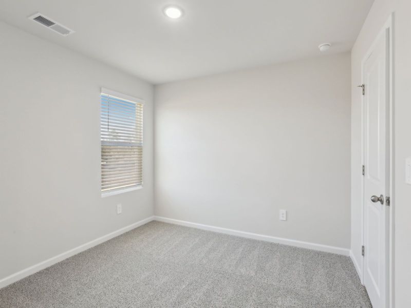 Secondary bedroom in the Dakota floorplan at 199 White Birch Lane.