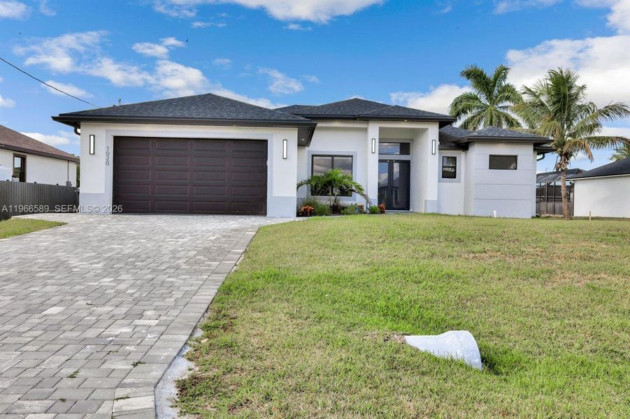 Front exterior of a new home in , Cape Coral, FL, highlighting curb appeal (Image 21).