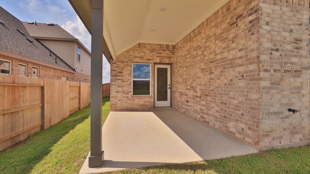 Exterior details and patio area of a home in Grand Magnolia, Magnolia (Image 3).