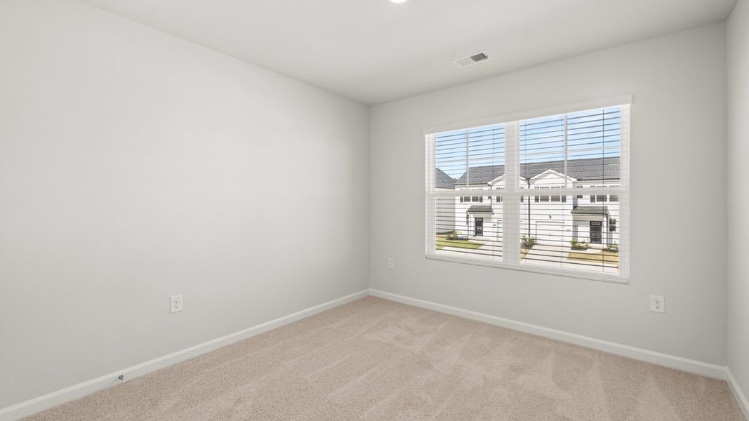 Spacious, unfurnished interior of a new home in Byrd Village, Graniteville (Image 24).