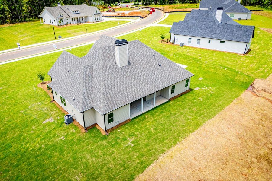 Exterior details and patio area of a home in WOODMONT RESERVE, Roopville (Image 4).