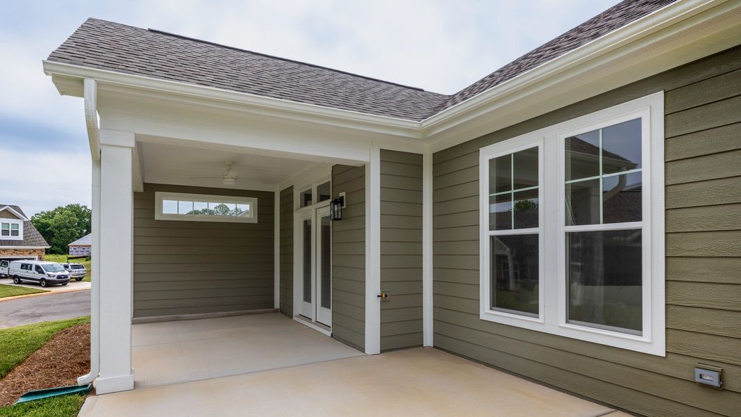 Exterior details and patio area of a home in The Villas at Pinewood, Asheboro (Image 26). Exterior details and patio area of a home in The Villas at Pinewood, Asheboro (Image 26).