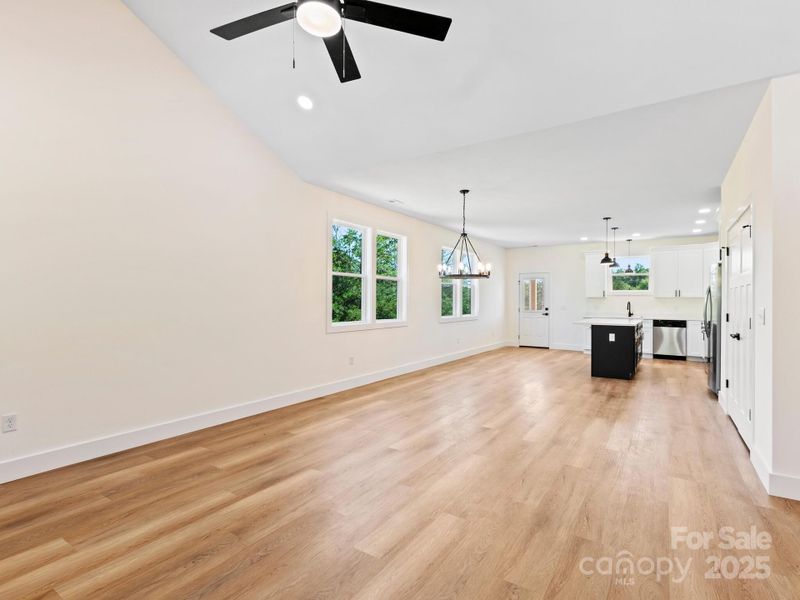 Living room flows into the dining space and then into the kitchen.