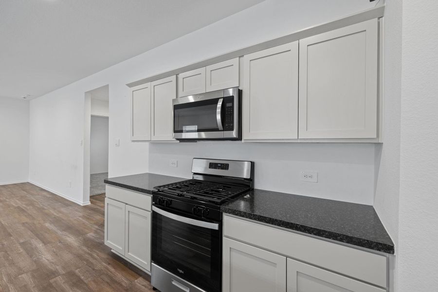 Meal prep area with cabinet and counter space. Meal prep area with cabinet and counter space.