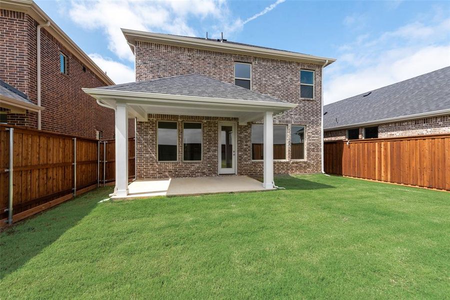 Exterior details and patio area of a home in Spiritas Ranch, Little Elm (Image 22).
