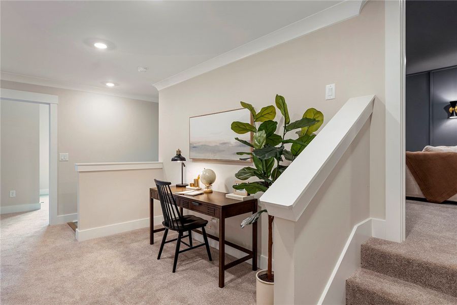 This versatile loft area offers a dedicated worksp