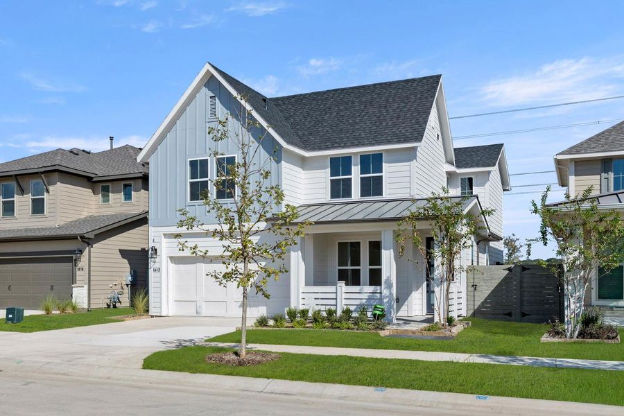 Front exterior of a new home in Cottage Collection at Harvest, Argyle, TX, highlighting curb appeal (Image 2).