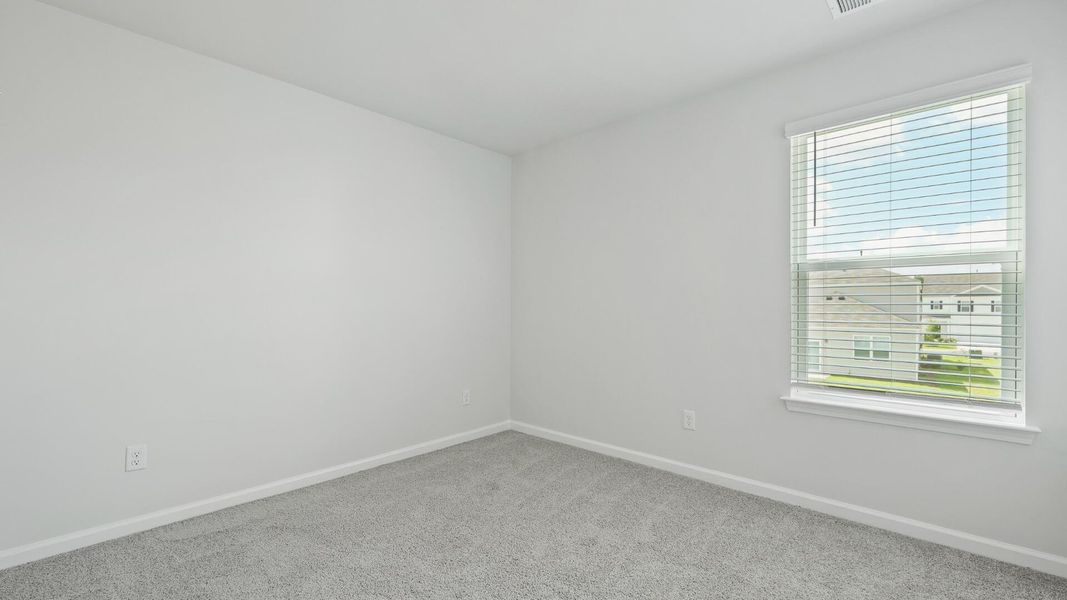 Spacious, unfurnished interior of a new home in Pine Hills at Cane Bay, Summerville (Image 12).
