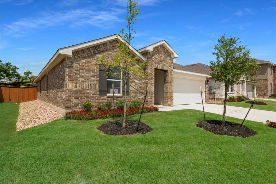 Front exterior of a new home in Bar W Ranch, Leander, TX, highlighting curb appeal (Image 24).