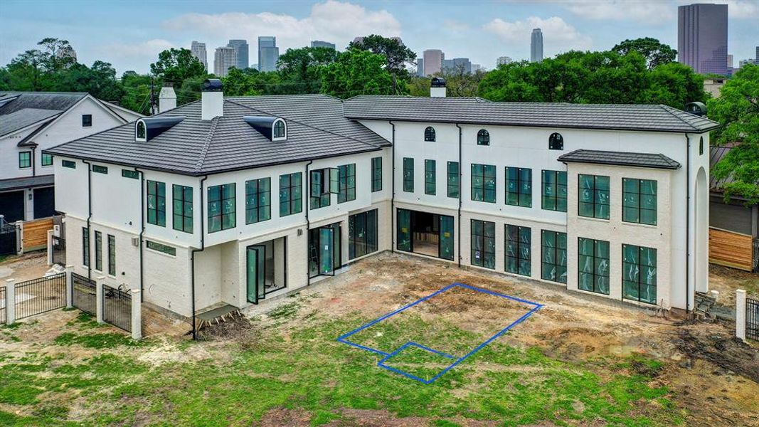 Aerial view as of April 3, 2025 of this beautiful, new construction home showing the pool area and fantastic Tanglewood location near The Galleria. Aerial view as of April 3, 2025 of this beautiful, new construction home showing the pool area and fantastic Tanglewood location near The Galleria.
