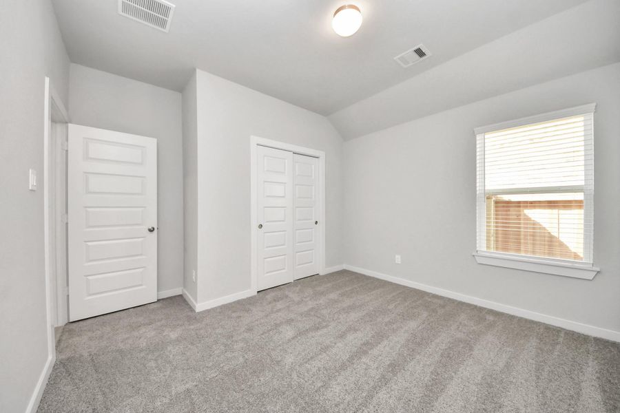 Generously sized secondary bedrooms featuring spacious closets, soft and inviting carpeting underfoot, large windows allowing plenty of natural light, and the added touch of privacy blinds for your personal retreat. Sample photo of completed home with similar floor plan. Actual colors and selections may vary. Sample photo of completed home with similar floor plan. Actual colors and selections may vary. Generously sized secondary bedrooms featuring spacious closets, soft and inviting carpeting underfoot, large windows allowing plenty of natural light, and the added touch of privacy blinds for your personal retreat. Sample photo of completed home with similar floor plan. Actual colors and selections may vary. Sample photo of completed home with similar floor plan. Actual colors and selections may vary.