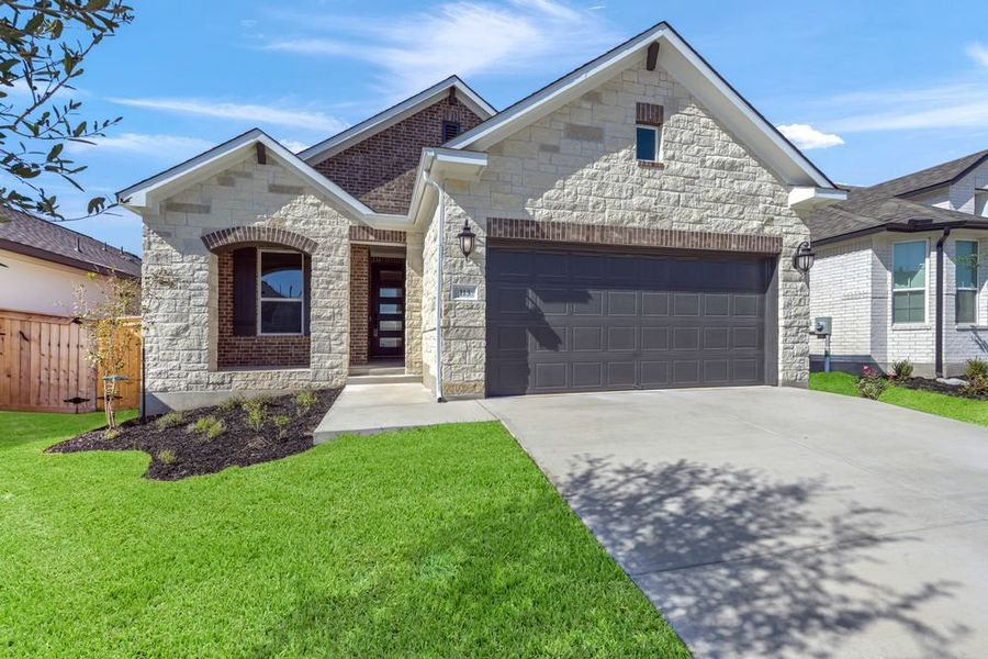 Front exterior of a new home in Nolina 45s, Georgetown, TX, highlighting curb appeal (Image 14).