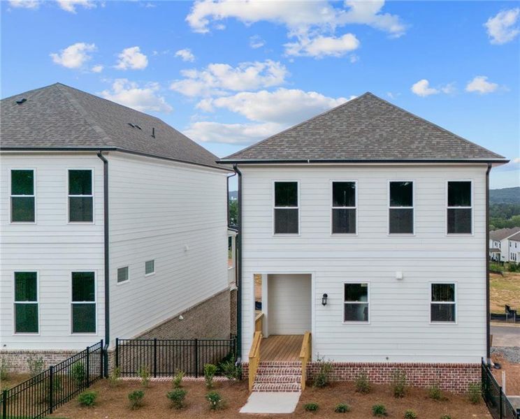 Exterior details and patio area of a home in Palisades Single Family, Cumming (Image 3).