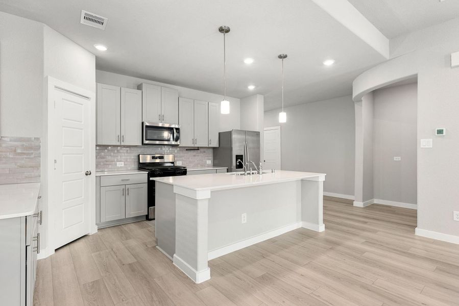 Furnished interior view inside a new home in Sundance Cove - Premier Series, Crosby (Image 13).