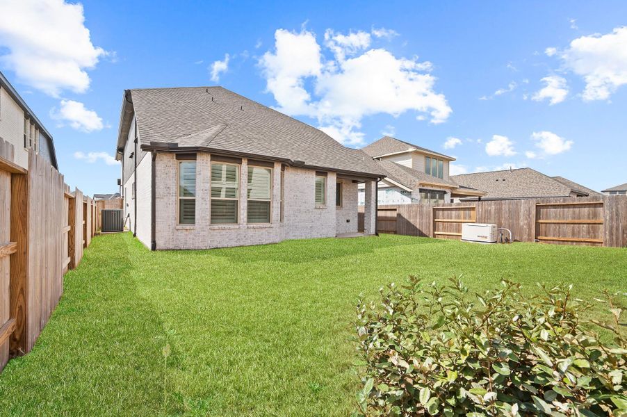 Exterior details and patio area of a home in Brookewater, Rosenberg (Image 31).