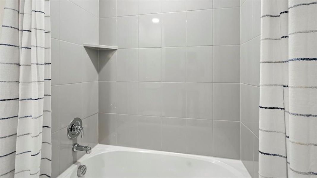 Bathroom with shower / tub combo with curtain