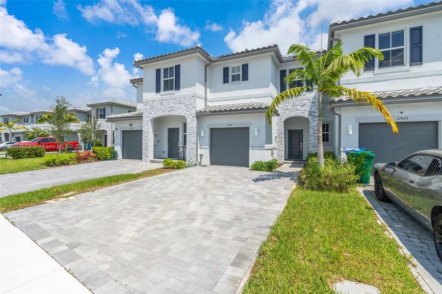 Front exterior of a new home in , Coral Springs, FL, highlighting curb appeal (Image 19).