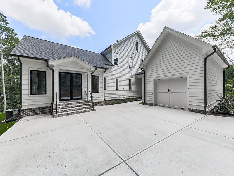 Front exterior of a new home in , Ball Ground, GA, highlighting curb appeal (Image 31).