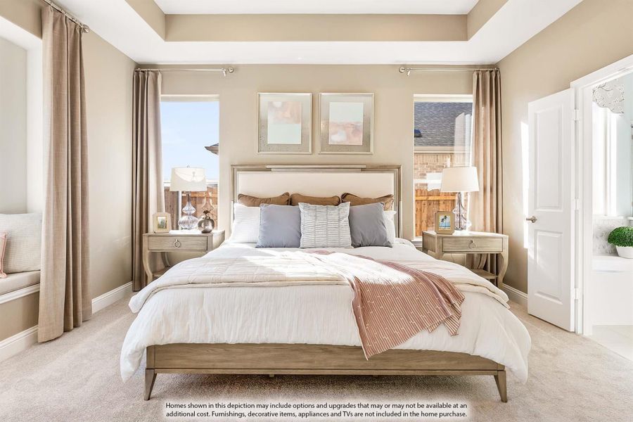 Master bedroom with tray ceiling, king bed, neutral tones, two windows, and carpet flooring