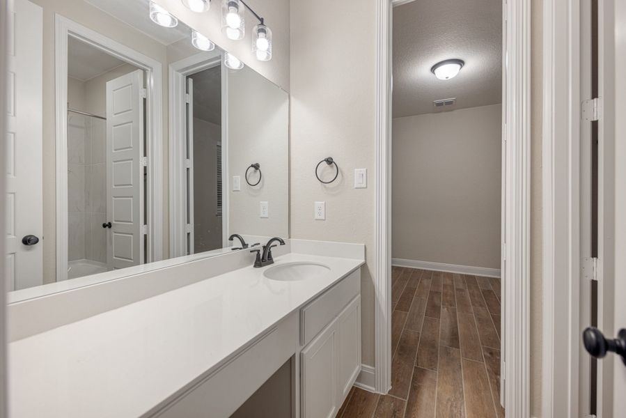 Representative furnished interior of a home built from the Mackenzie by Chesmar Homes in Sienna Lakes, San Antonio (Image 8).
