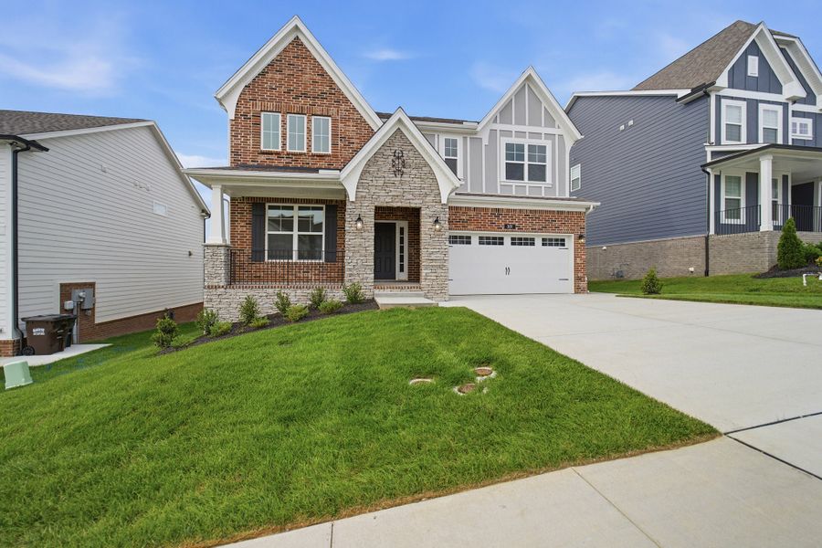 Front exterior of a new home in The Retreat at Norman Farm, Hendersonville, TN, highlighting curb appeal (Image 2).